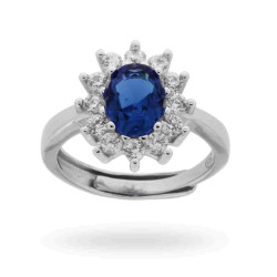 ANELLO SOLITARIO A GRIFFE CON ZIRCONE OVALE BLU ZAFFIRO CONTORNATO CON ZIRCONI BIANCHI IN ARGENTO 925 RODIATO